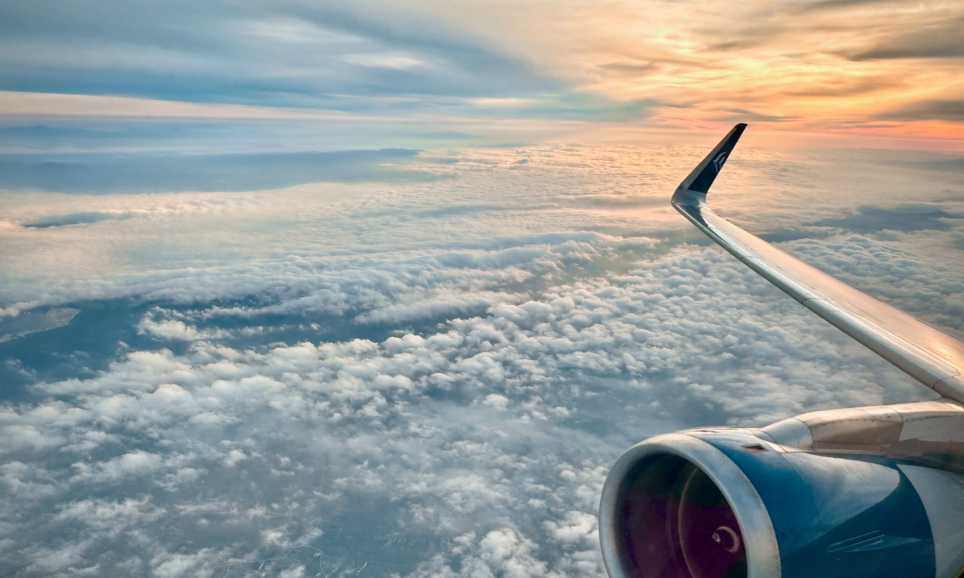 Sunrise seen through an airplane window after departure from Thessaloniki.