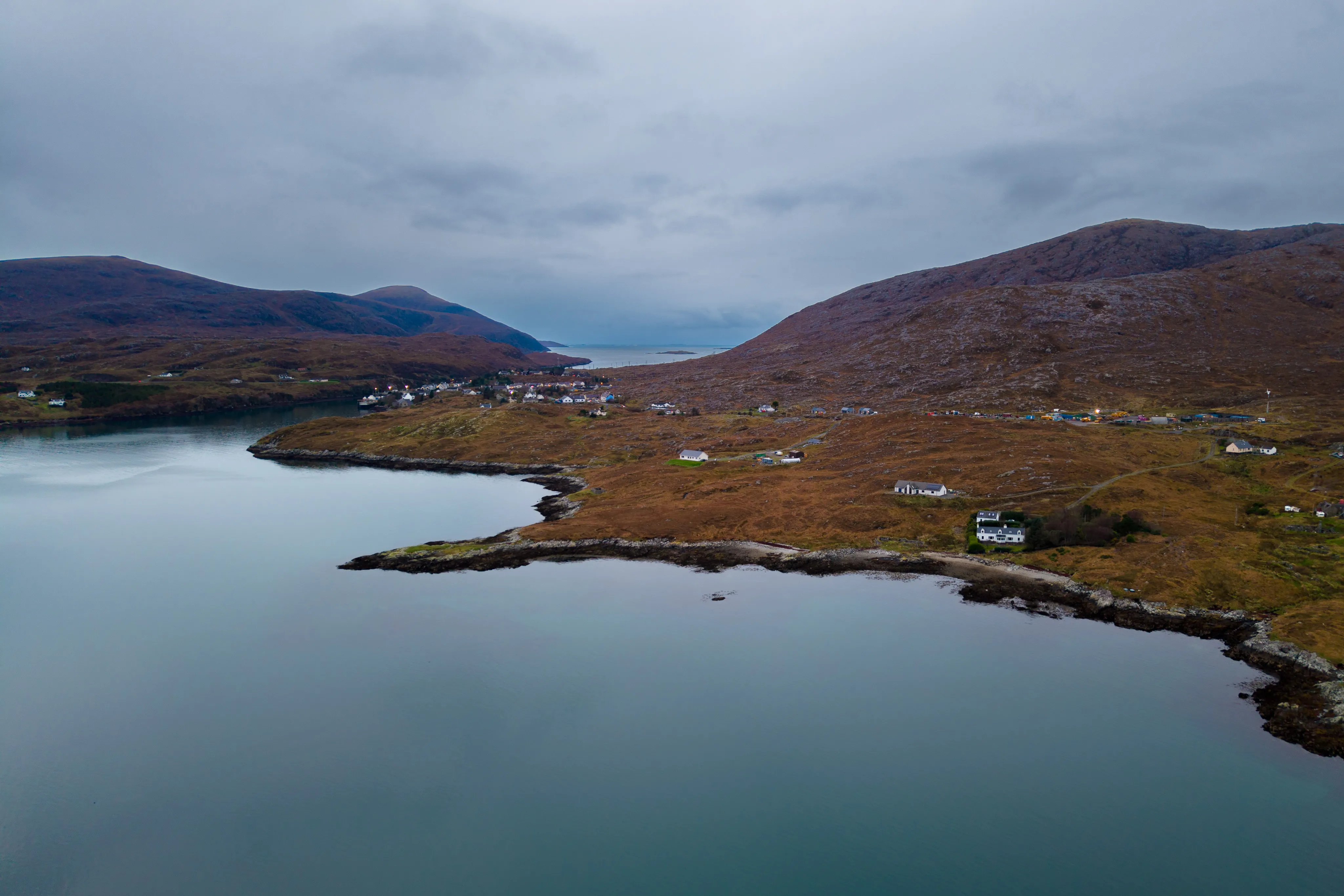 A white house beside slate-blue water at Lingerbay on the Isle of Harris.